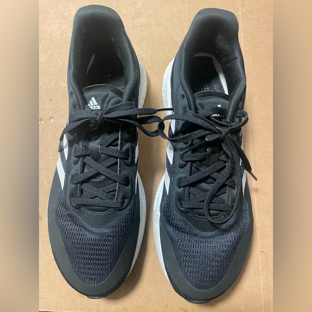 Adidas Black and White Supernova Athletic Sneakers